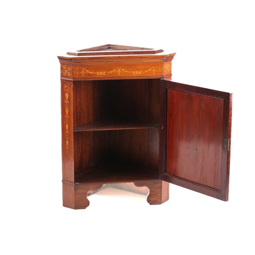 123 - An Edwardian mahogany and Neo-Classical marquetry inlaid freestanding corner display cabinet, in the... 