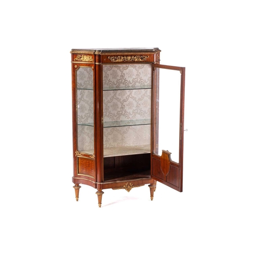 124 - A French Louis XVI style mahogany single door marble topped vitrine, late 19th century, of concave c... 