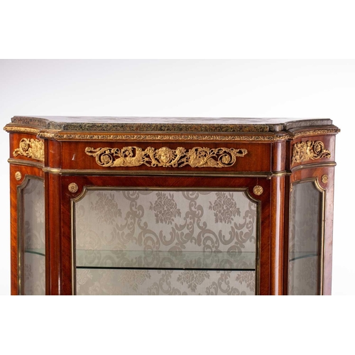 124 - A French Louis XVI style mahogany single door marble topped vitrine, late 19th century, of concave c... 