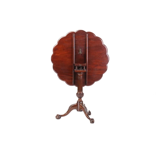 130 - A George III style mahogany revolving supper table, 20th century (but a faithful copy), the circular... 