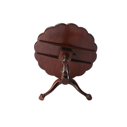 130 - A George III style mahogany revolving supper table, 20th century (but a faithful copy), the circular... 