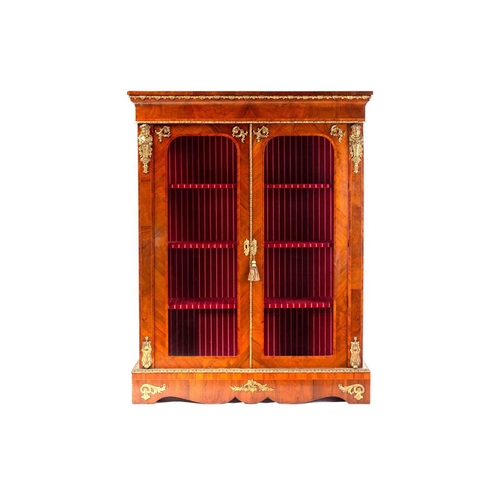 134 - A Victorian French style two door figured walnut vitrine, with satin wood stringing and tulipwood ba... 