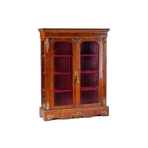 134 - A Victorian French style two door figured walnut vitrine, with satin wood stringing and tulipwood ba... 