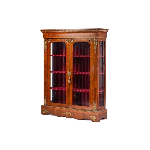 134 - A Victorian French style two door figured walnut vitrine, with satin wood stringing and tulipwood ba... 