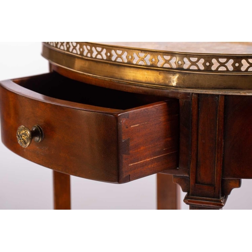 139 - A French Napoleon III style mahogany oval table en chiffonier with marble top, 20th century, with pi... 