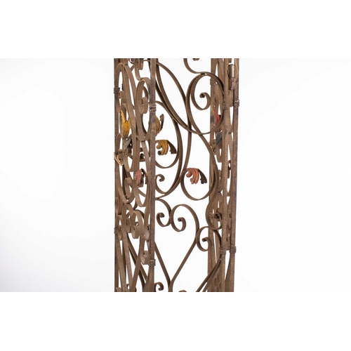 142 - An Italianate wrought iron three panel room screen, 20th century ,with verdigris painted scrolling t... 