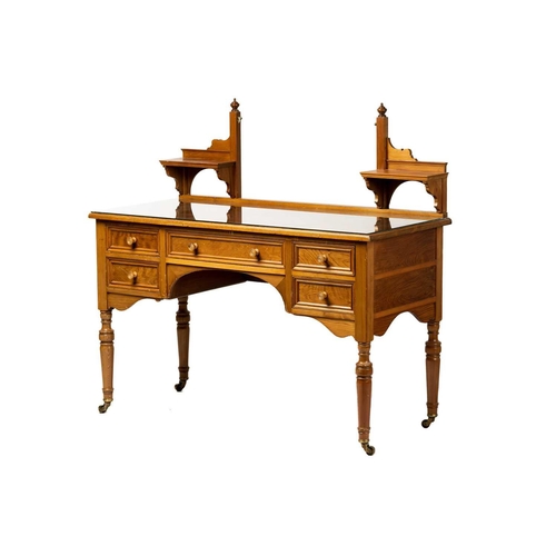 151 - An Edwardian pine? dressing table by Howard & Sons, the swing mirror on shelved supports above a kne... 