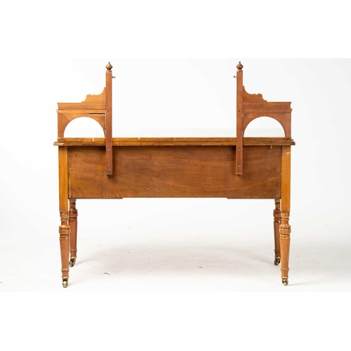 151 - An Edwardian pine? dressing table by Howard & Sons, the swing mirror on shelved supports above a kne... 