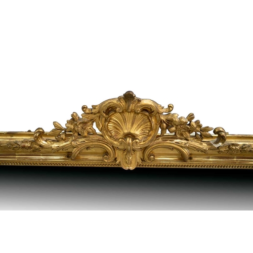 154 - A late 19th-century French giltwood framed mirror, with shell and floral garland surmount, 154 cm x ... 