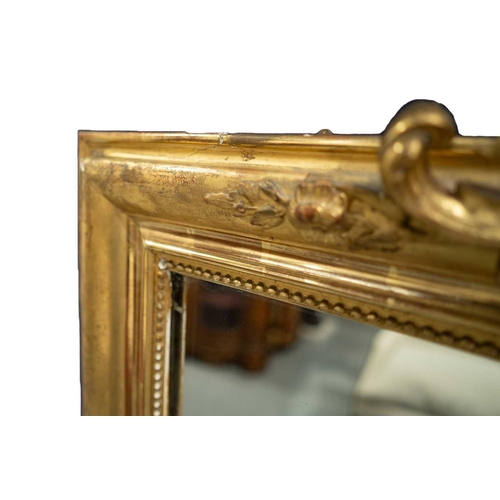 154 - A late 19th-century French giltwood framed mirror, with shell and floral garland surmount, 154 cm x ... 