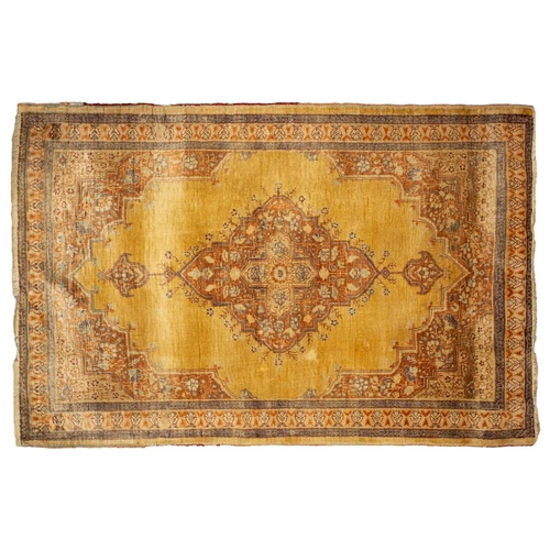 155 - A matched pair of golden ground Turkish silk on silk mats, early 20th century, with central lozenge ... 