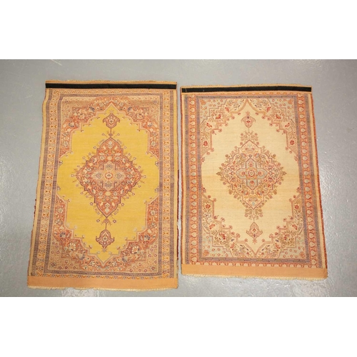 155 - A matched pair of golden ground Turkish silk on silk mats, early 20th century, with central lozenge ... 