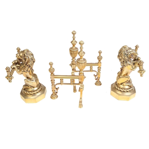 172 - A pair of Victorian cast and gilt brass heraldic sejant erect lion firedogs, each holding a decorati... 