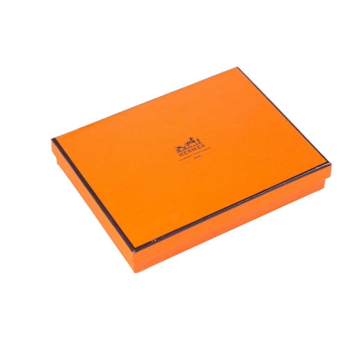 179 - A presentation boxed Hermes of Paris set of four porcelain individual ashtrays in colours with styli... 