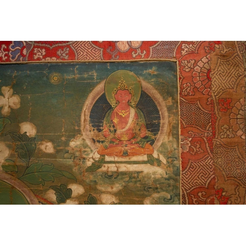 80 - A Tibetan Thangka, early 20th century, Sakyamuni Buddha, seated on a cloud cushion within a garden s... 