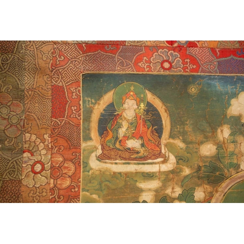 80 - A Tibetan Thangka, early 20th century, Sakyamuni Buddha, seated on a cloud cushion within a garden s... 