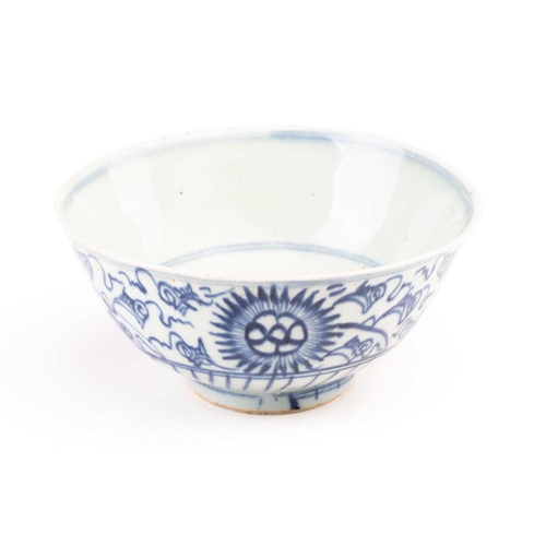 86 - A Chinese Swatow blue and white bowl, Ming/Qing, painted with stylised chrysanthemums, the interior ... 