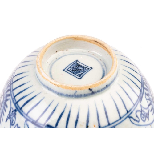 86 - A Chinese Swatow blue and white bowl, Ming/Qing, painted with stylised chrysanthemums, the interior ... 