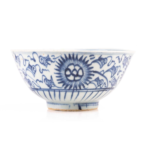 86 - A Chinese Swatow blue and white bowl, Ming/Qing, painted with stylised chrysanthemums, the interior ... 