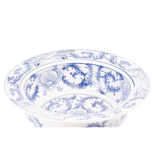 86 - A Chinese Swatow blue and white bowl, Ming/Qing, painted with stylised chrysanthemums, the interior ... 