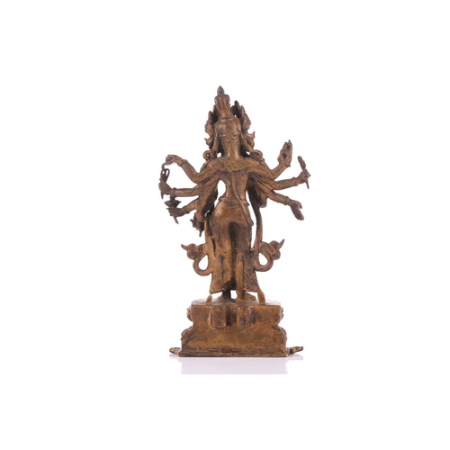 88 - A Nepalese bronze figure of Bodhisattva Avalokiteshvara, early 20th century, the eight armed deity h... 