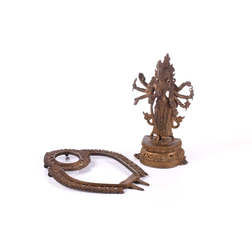 88 - A Nepalese bronze figure of Bodhisattva Avalokiteshvara, early 20th century, the eight armed deity h... 