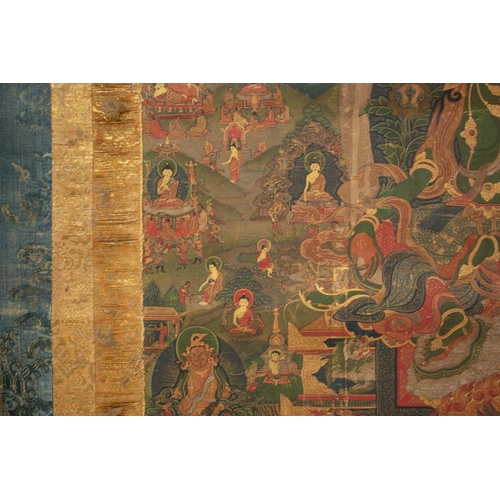 92 - A Tibetan Green Tara - sGrol-ma, possibly 18th century, surrounded by buddhas, divinities and Dalai ... 