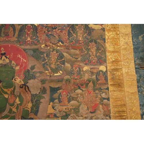 92 - A Tibetan Green Tara - sGrol-ma, possibly 18th century, surrounded by buddhas, divinities and Dalai ... 