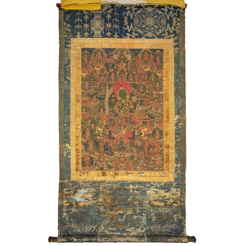 92 - A Tibetan Green Tara - sGrol-ma, possibly 18th century, surrounded by buddhas, divinities and Dalai ... 