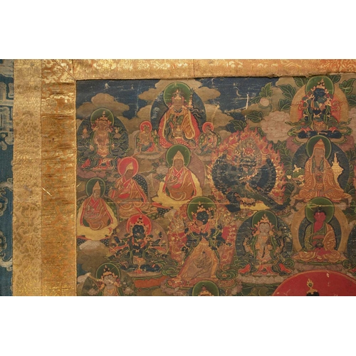 92 - A Tibetan Green Tara - sGrol-ma, possibly 18th century, surrounded by buddhas, divinities and Dalai ... 