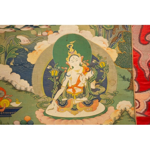 99 - A Tibetan Thangka of Amitayus, early 20th century, seated within a gilt sunburst halo, with deities,... 