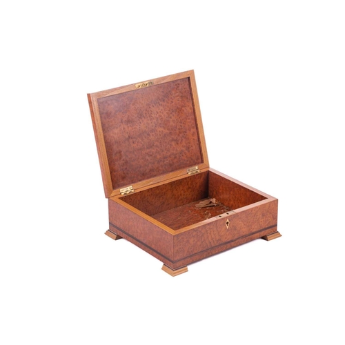 192 - David Linley a rectangular amboyna and zebrano strung cigar box, the hinged cover bearing an inset e... 