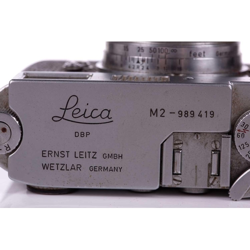 196 - A 1960 Leica M2 Rangefinder camera, chrome, serial no. 989419, with Leitz Elmar Summicron lens, f=5c... 