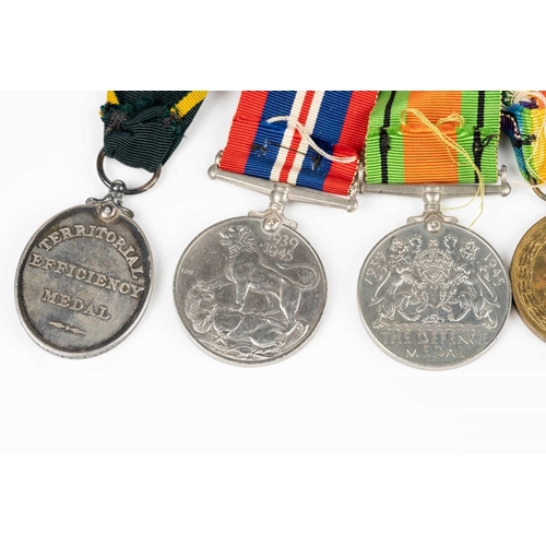 204 - A WWI and WWII medal group, comprising a 1914-15 Star, a WW1 Campaign and a Victory medal, each name... 