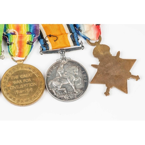 204 - A WWI and WWII medal group, comprising a 1914-15 Star, a WW1 Campaign and a Victory medal, each name... 