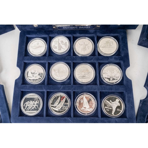 209 - A collection of 72 official silver proof commemorative coins of the Olympic Games, with certificates... 