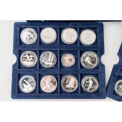 209 - A collection of 72 official silver proof commemorative coins of the Olympic Games, with certificates... 