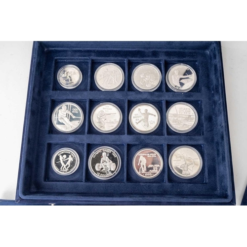 209 - A collection of 72 official silver proof commemorative coins of the Olympic Games, with certificates... 