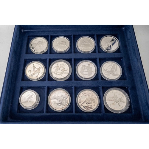 209 - A collection of 72 official silver proof commemorative coins of the Olympic Games, with certificates... 