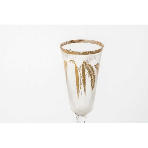 213 - A late 18th century ale glass, the long rounded bowl with gilt edge, barley and floral sprays, on a ... 