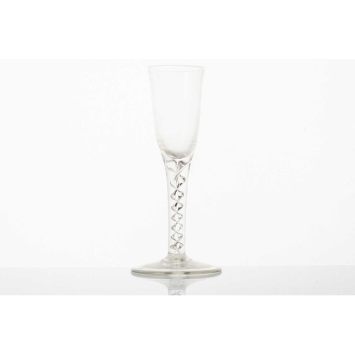 214 - A mid-18th century air-twist ale glass, with long bowl over a twin thread stem and circular foot, 17... 