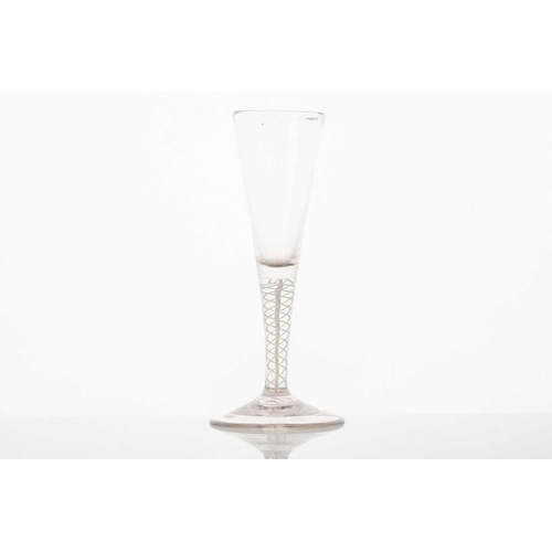 214 - A mid-18th century air-twist ale glass, with long bowl over a twin thread stem and circular foot, 17... 