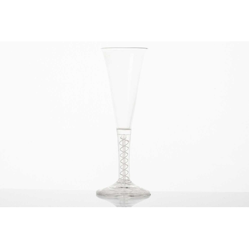 215 - An 18th century ale glass, the ogee bowl on a multiple opaque air twist stem and conical circular fo... 