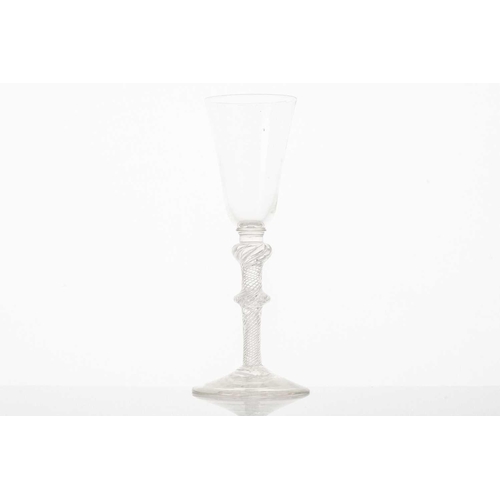 217 - A late 18th century wine glass, the trumpet form bowl with hops and barley, on a plain stem and fold... 