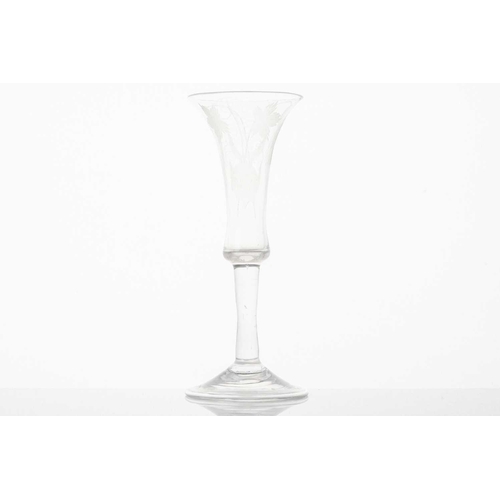 217 - A late 18th century wine glass, the trumpet form bowl with hops and barley, on a plain stem and fold... 