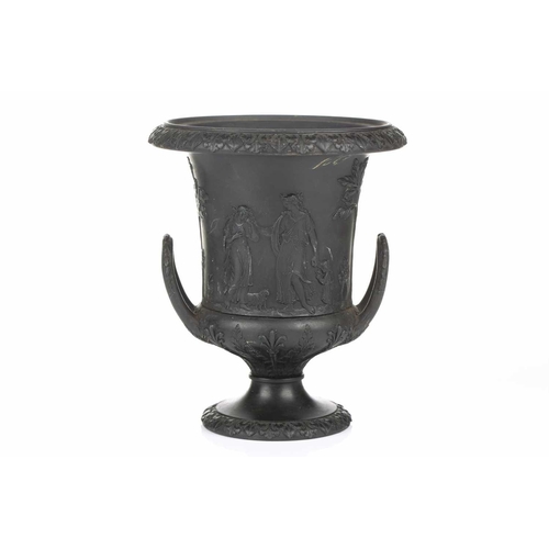 221 - A 19th century Wedgwood black basalt urn of Campagna form, relief decorated with neo-classical figur... 