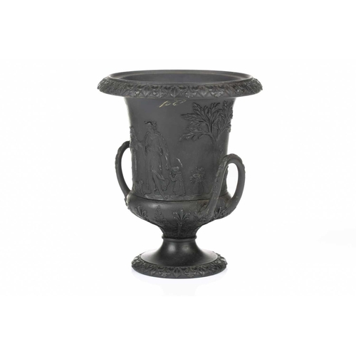 221 - A 19th century Wedgwood black basalt urn of Campagna form, relief decorated with neo-classical figur... 