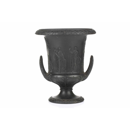 221 - A 19th century Wedgwood black basalt urn of Campagna form, relief decorated with neo-classical figur... 