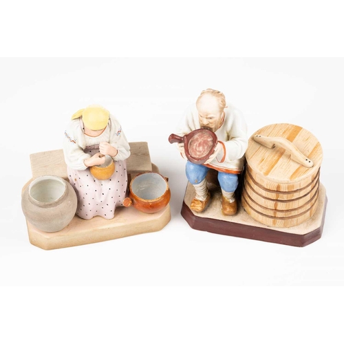 222 - A pair of Russian Gardner porcelain figures of a Peasant Woman churning butter, 13.5 cm high and a P... 