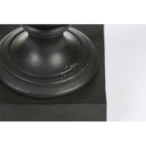 227 - Wedgwood & Bentley, Etruria: a late 18th century black basalt urn and cover, of plain form on a squa... 